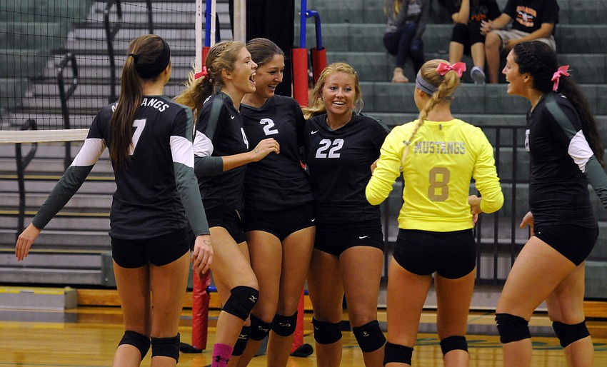 The Lakewood Ranch High volleyball team celebrates a point during its 3-0 victory over Sarasota in the Class 7A-District 10 championship Oct. 23.