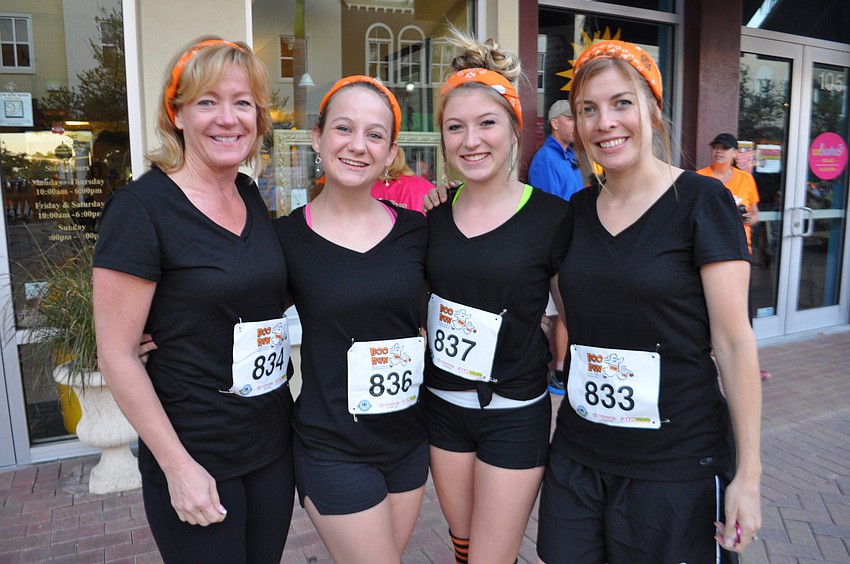 Diana and Sarah Dill run with Shelby and Lynne Roskamp.