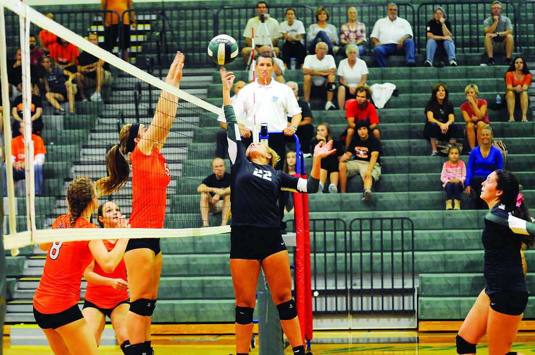 Lakewood Ranch setter Courtney Rapp records a point for the Lady Mustangs. Photo by Jen Blanco