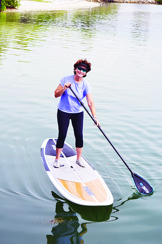 A former canoeing instructor, Barbara Brizdle takes easily to the paddleboard. Photo by Molly Schechter