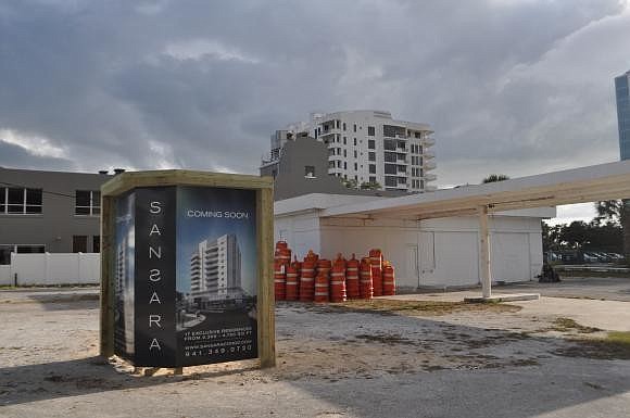 Sansara, a luxury condominium building, will be constructed following the demolition of the gas station property.