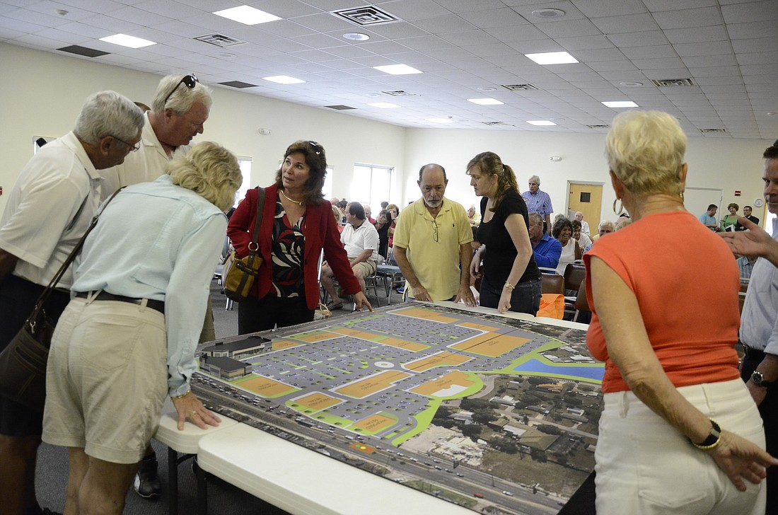 Not all residents' fears about traffic and privacy were assuaged by the Siesta Promenade project rendering provided by Benderson.