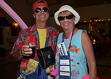 Vince and Betty Mascio dressed as first-time visitors to Sarasota complete with brochures to popular attractions.