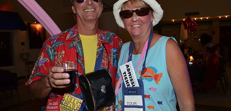 Vince and Betty Mascio dressed as first-time visitors to Sarasota complete with brochures to popular attractions.
