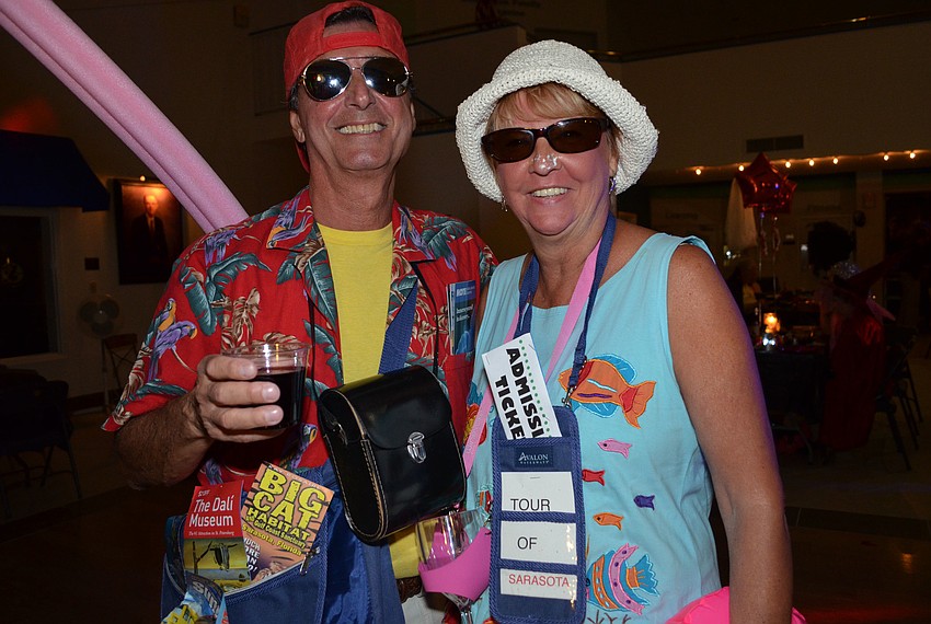 Vince and Betty Mascio dressed as first-time visitors to Sarasota complete with brochures to popular attractions.
