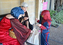 Merchants handed out candy to trick-or-treaters in Siesta Key Village.