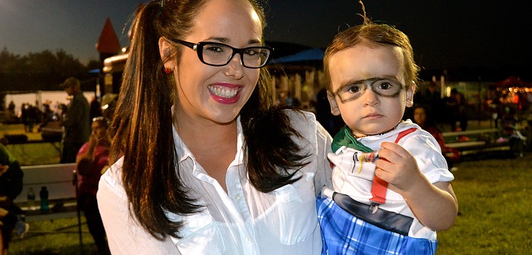 Bailey Pickett and her son, Liam, wear matching costumes.