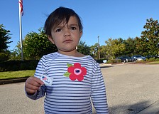 Sophie Kulatilaka-Rivers accompanies her mother, Ishani, on Election Day.