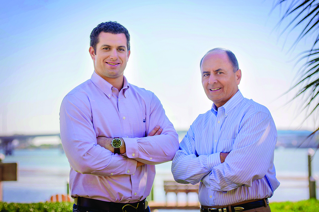 Devyn Dugger, president of Dickerson Distributing, and John Saputo, Gold Coast Eagle Distributing CEO. Courtesy photo