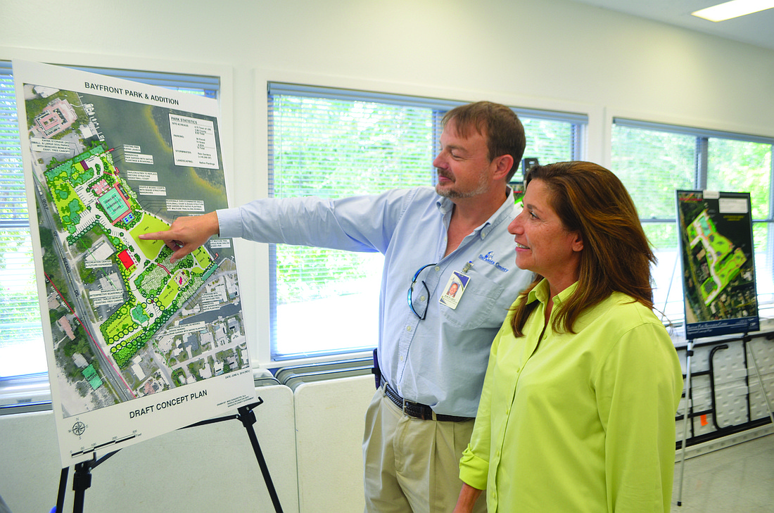 Joanne Assaly, right, looks at the current Bayfront Park concept with Sarasota County worker Rob LaDue. Photo by Kristen Herhold