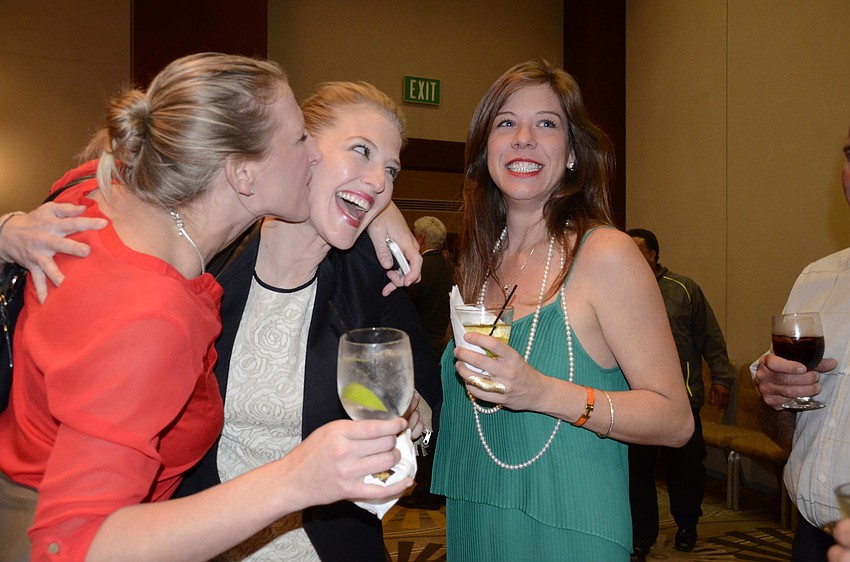 Two of Bridget Ziegler's supporters, Deva O'Donnell, left, and Sarah Sturm, right, embrace her as she walks into the ballroom at the Hyatt Regency, Sarasota. Ziegler narrowly beat her opponent Kent Marsh for the Sarasota County School Board District 1.