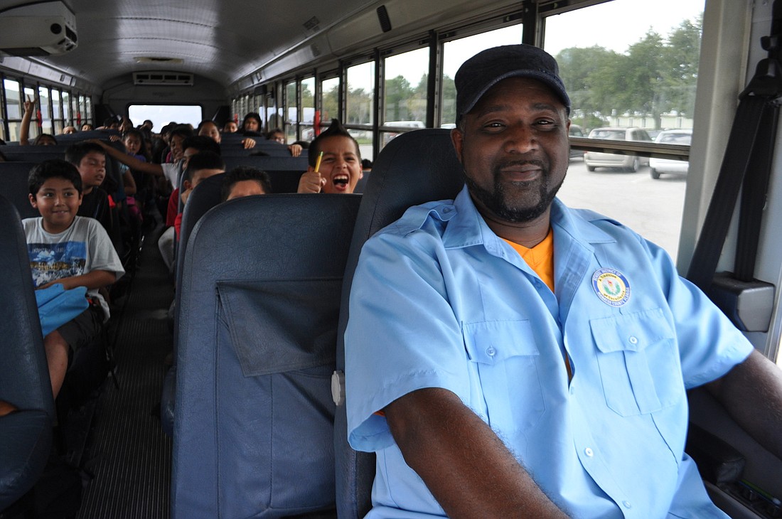 Mike McCarter drives off with his passengers from McNeal Elementary for the last time.
