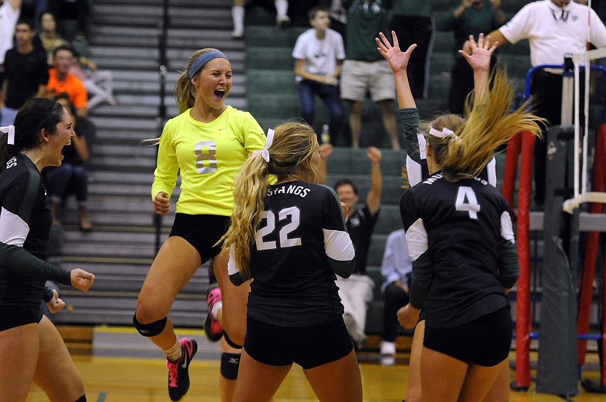 The Lakewood Ranch High volleyball team celebrates following its 3-1 victory over Sarasota in the Class 7A-Region 3 semifinals Nov. 4.