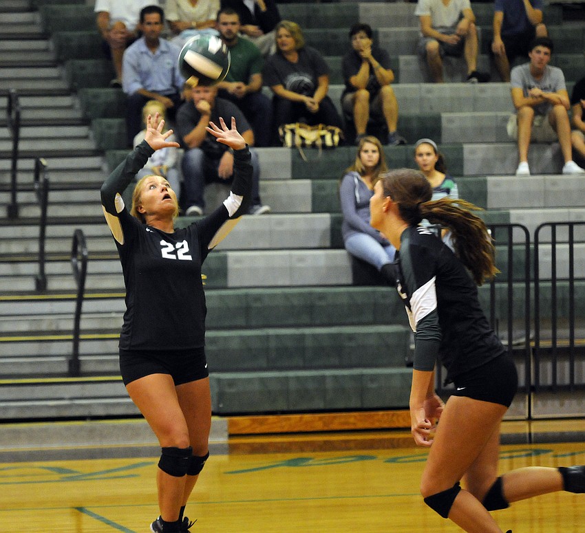 Lakewood Ranch senior setter Courtney Rapp, who was credited with 39 assists, passes the ball to fellow senior Nicole Grant.