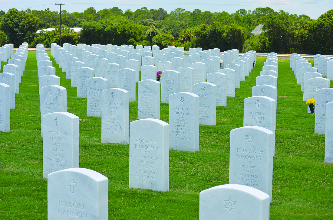 The graves at Sarasota National Cemetery will be decorated with flags for Memorial Day next year. File photo
