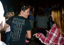 Heather Hall and Valerie Jackson dance to the music.