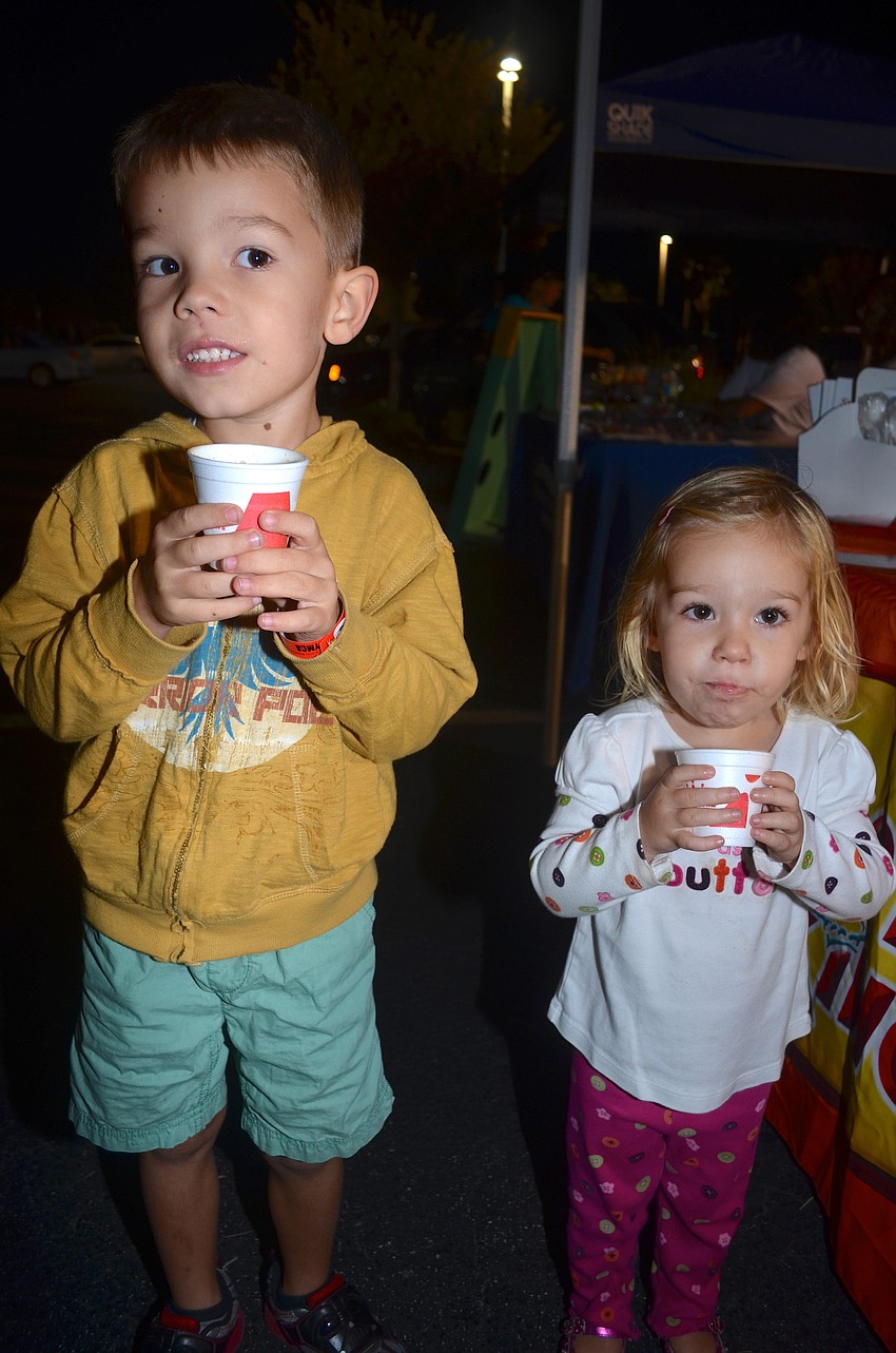 Tobin and Brynn Heyman sip on frozen drinks.