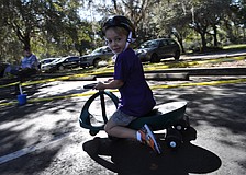 Logan Cole is the fastest child around the track, even though he rides a plasma car instead of a tricycle.