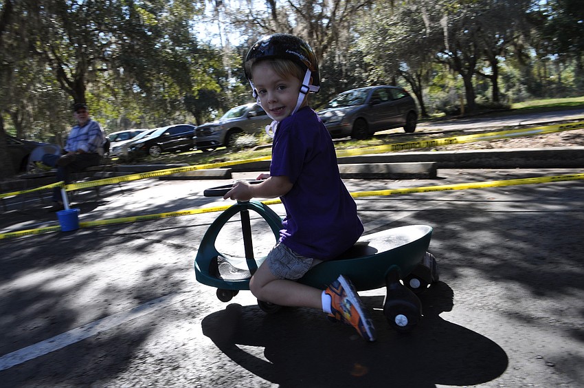 Logan Cole is the fastest child around the track, even though he rides a plasma car instead of a tricycle.