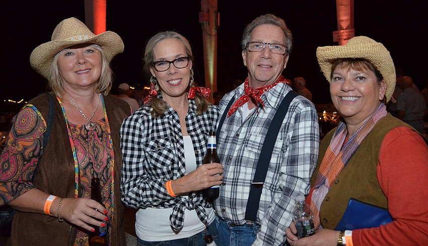 Sheila Lewis, Lynn Shaffer, Bob Shaffer and Debra Lynn-Schmitz.attend Sandfest 2014 at Siesta Beach.