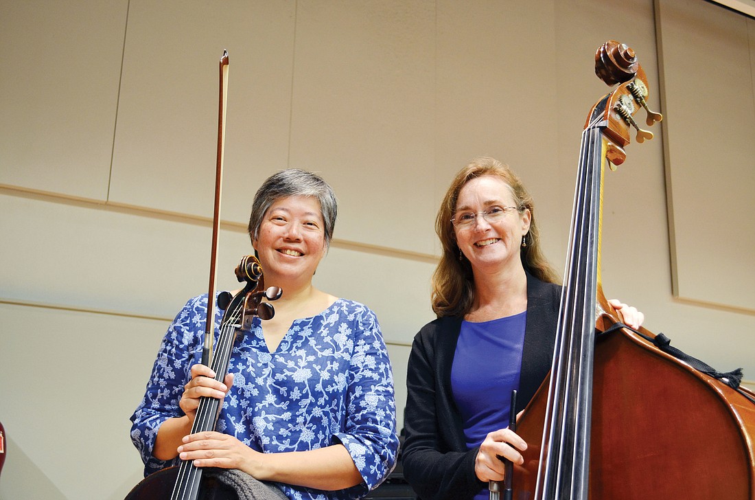 Cheeko Matsusaka and RoseAnne McCabe rehearse for "Songs of Wars I Have Seen."