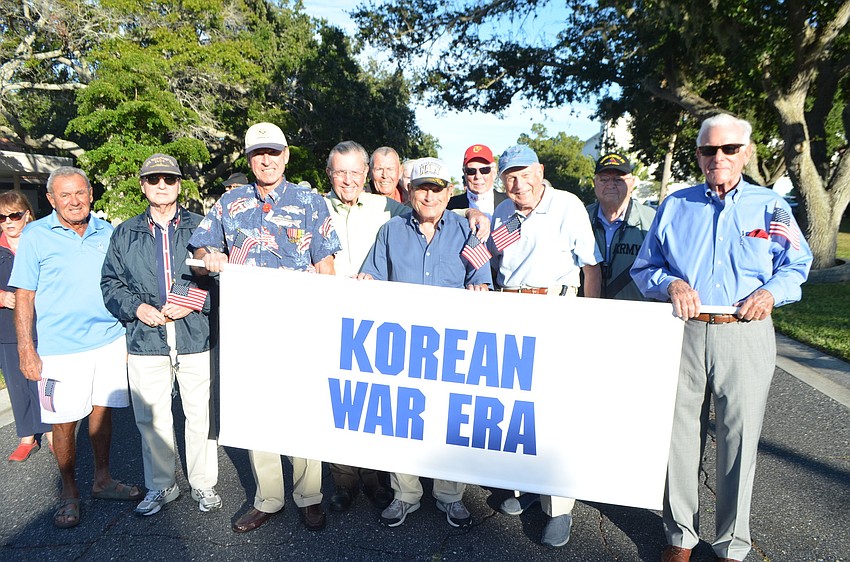 Korean War era veterans begin their march in the parade.
