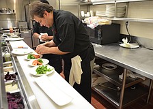 Executive Chef Andrea Bozzolo creates an arugula salad.