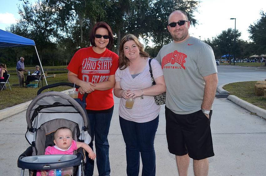 The Whitt family â€” Scarlett, Megan, Meagan and Zac â€” enjoy the event's food.