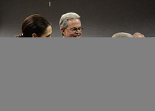 Mary Kenealy-Barbetta and her husband, former County Commissioner Joseph Barbetta and Commissioner Carolyn Mason chat at the reception for the new commissioners.