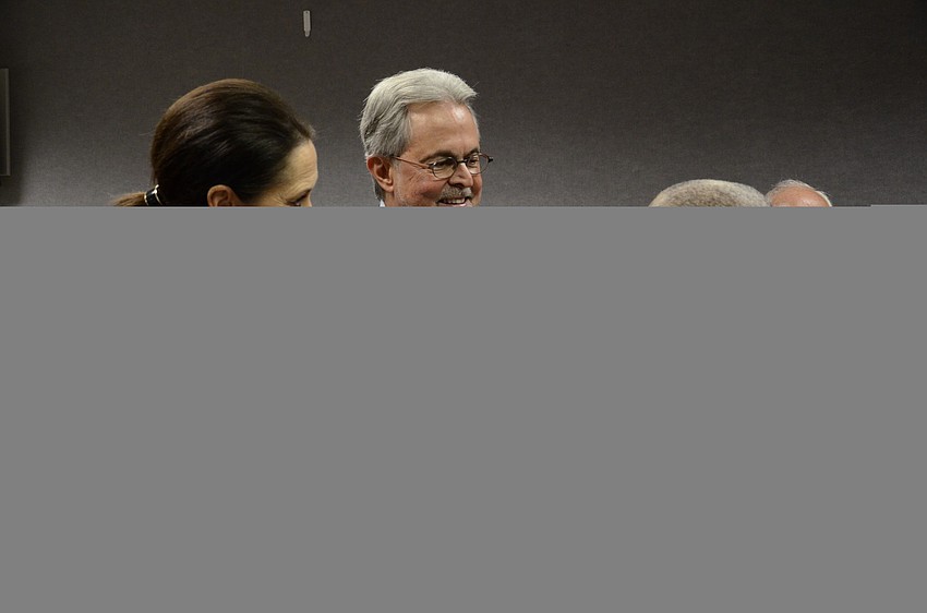 Mary Kenealy-Barbetta and her husband, former County Commissioner Joseph Barbetta and Commissioner Carolyn Mason chat at the reception for the new commissioners.
