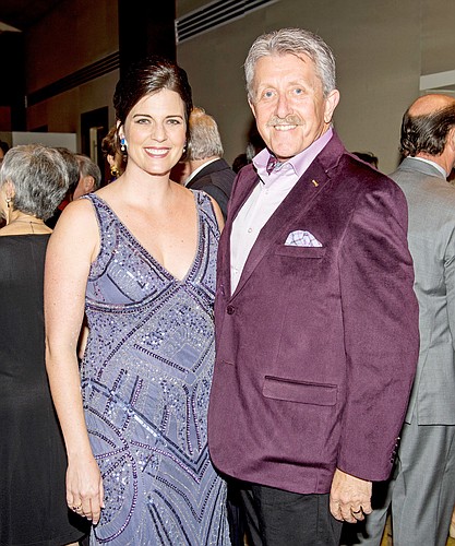 Kameron Partridge Hodgens, the new executive director of Glasser-Schoenbaum Human Services Center, and her predecessor, Phil King. Photo by Cliff Roles.