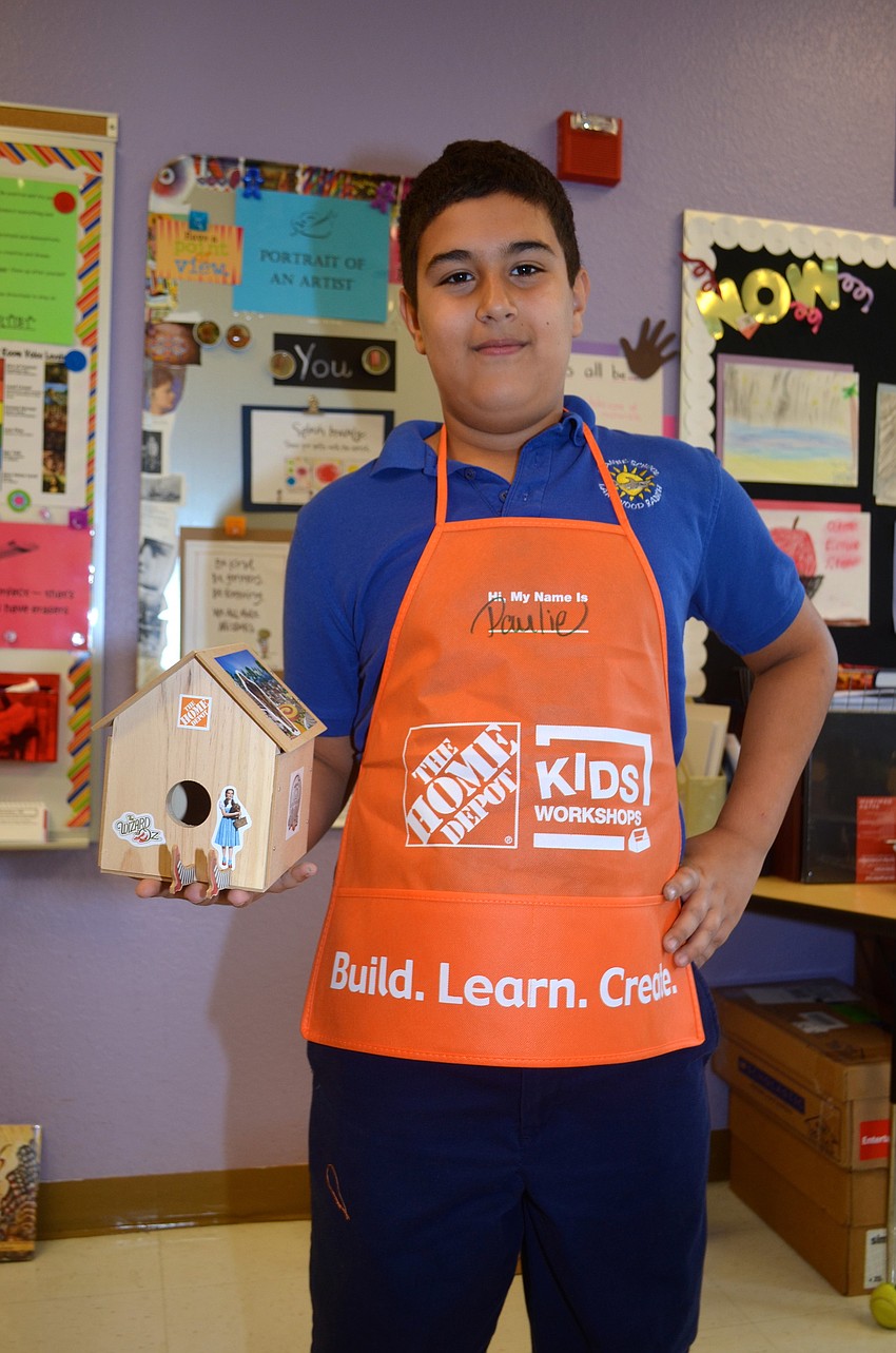 Paulie Dirende shows off his Home Depot apron, which now has his name written on the front.