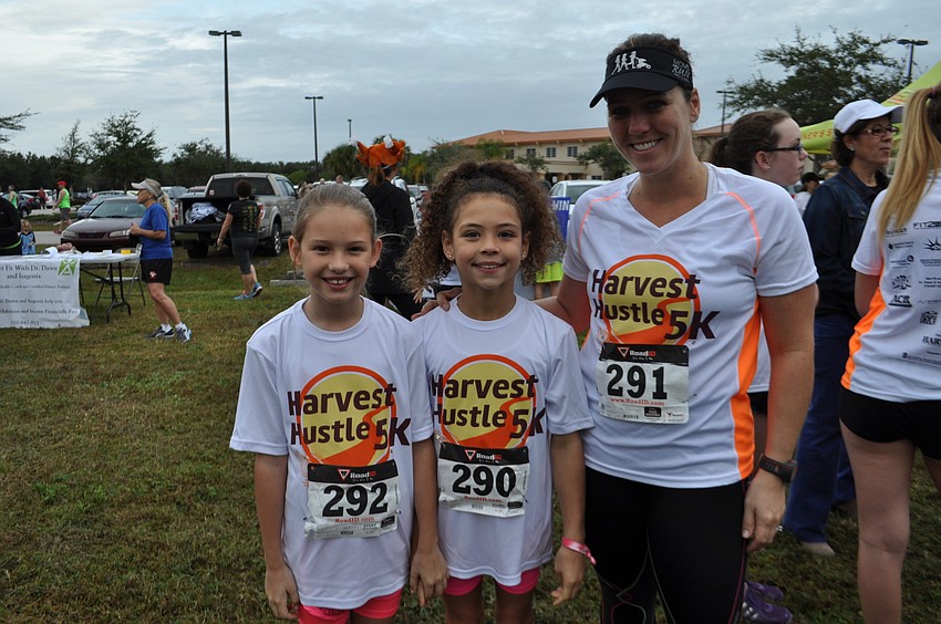 Ellie Barker runs her first 5K with the support of her friends Lilly and Bethany Lynch.