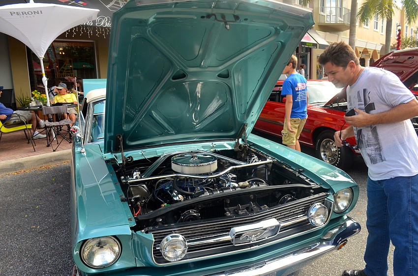 Jim Pacifico inspects a '96 Mustang.