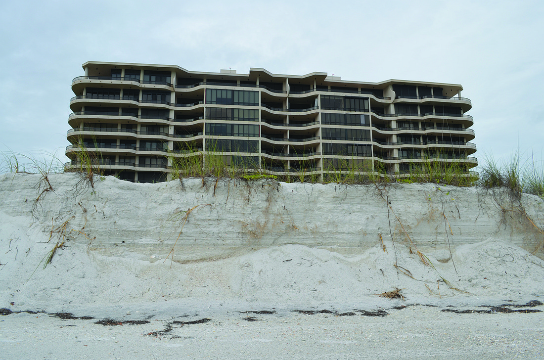 Sand loss around L'Ambiance, pictured, and other south end condominiums has drawn concern from residents. File photo