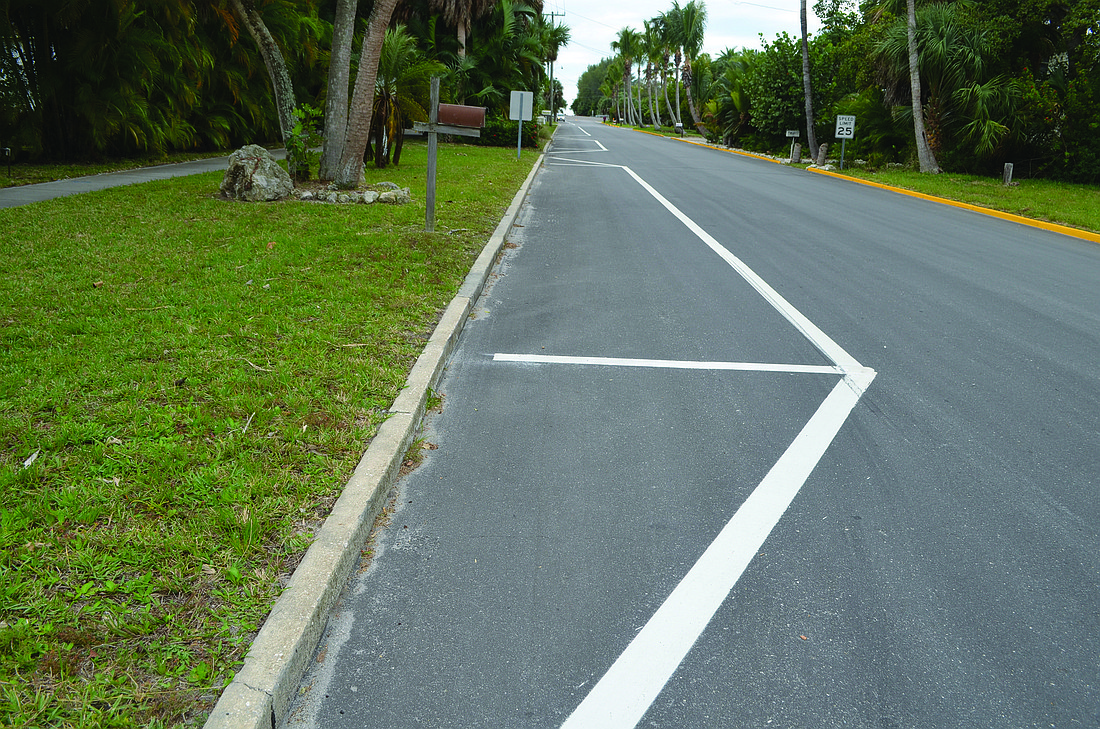 New white parking spaces were painted last week on the south side of Broadway, where parking is permitted. Photo by Kristen Herhold