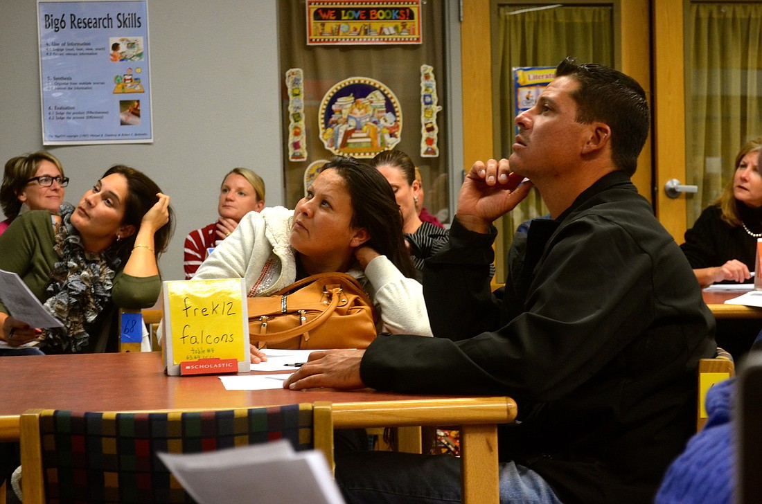 Parents try to understand the problems their children are learning in classrooms today. Photo by Amanda Sebastiano