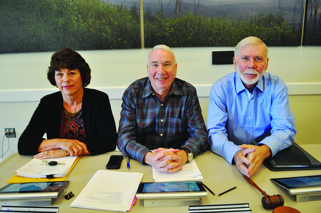 Susan Ellis, Henry Hofeler and Jim Rogoze participate in their first meeting as supervisors of Community Development District 6, the area known as Country Club West. Photo by Pam Eubanks