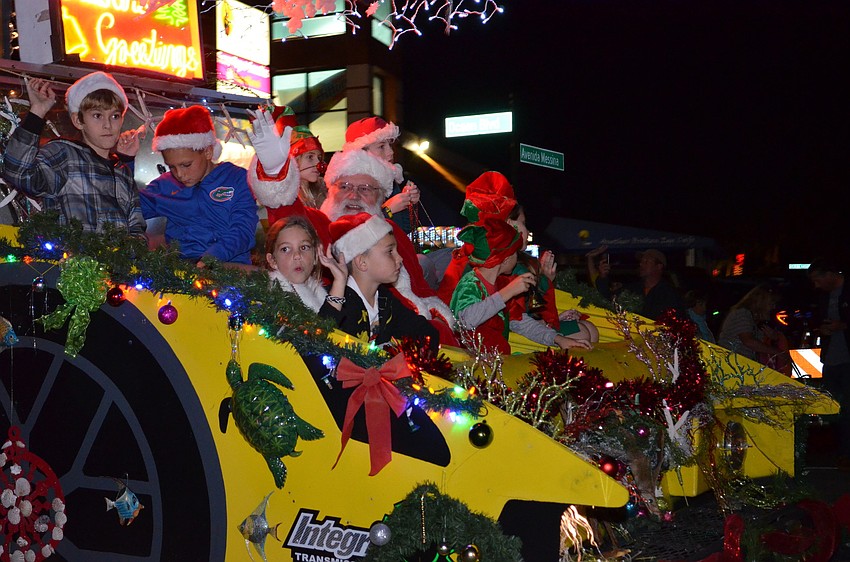 The Light Up The Village parade ended with the arrival of Santa Claus in Siesta Village.