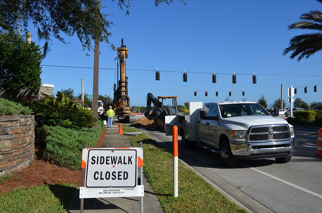 The eastbound right hand turn lane on State Road 70 at Lakewood Ranch Boulevard was closed off today so crews could work to dig holes for a new mast arm signal intersection.