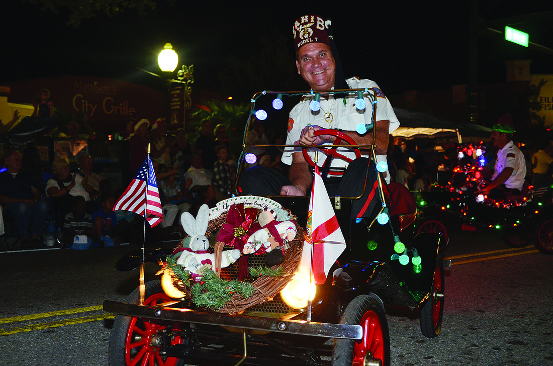 A Sahib Shriner, of Sahib Shrine Temple, drove a vintage car in last yearÃ¢â‚¬â„¢s Downtown Sarasota Holiday Parade. File photo