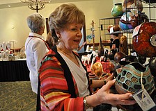 Marylee Danahy checks out gourds by Gourds by Jan Tonia.