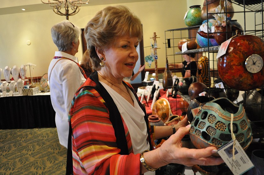Marylee Danahy checks out gourds by Gourds by Jan Tonia.