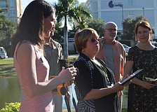 The Sarasota Chamber of Commerce presents Sarasota Garden Club President, Olivia Haynes with a plaque commemorating the lantern.