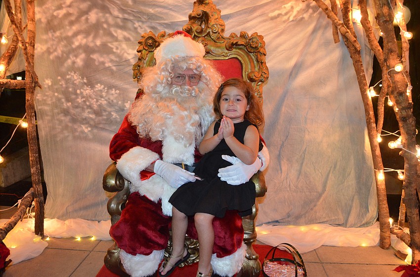 Michela Lombardi, 3, greets Santa