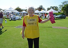 Norah Browne sells 50/50 raffle tickets, which raised $3,500.