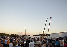 Hundreds of people came to watch Nik Wallenda walk a hundred feet above Sarasota Ford.