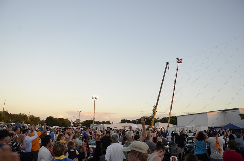 Hundreds of people came to watch Nik Wallenda walk a hundred feet above Sarasota Ford.
