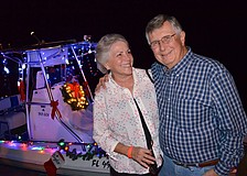 Mary and Newt McCollough enjoy the boats' lights.