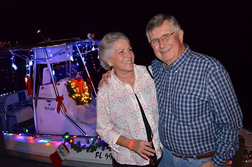 Mary and Newt McCollough enjoy the boats' lights.